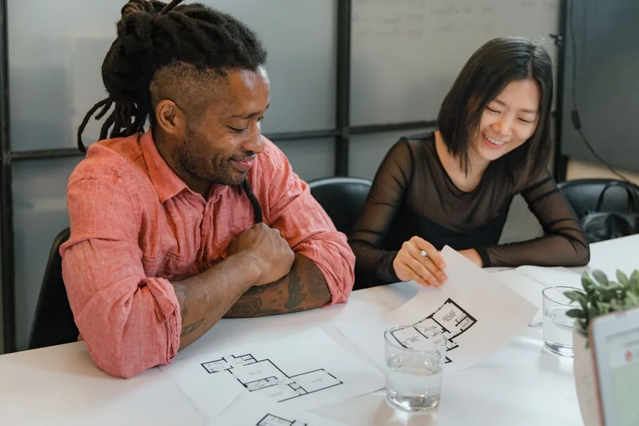 Real estate and architecture professionals reviewing property plans