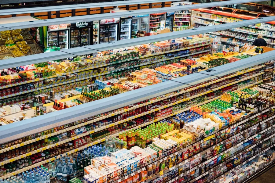 Fully stocked supermarket shelves with fast-moving consumer goods