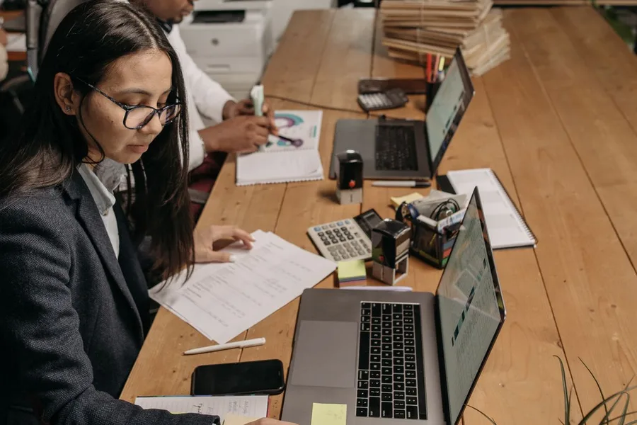 Accounting and finance professionals reviewing financial documents